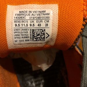 Men’s 9.5 Black, Orange, and Gray Converses